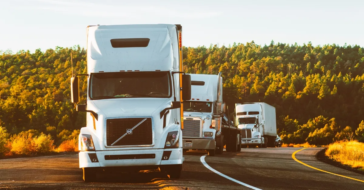 Home - Freight Brokerage, Freight Agents & LTL Freight Shipping Side-by-side comparison of LTL (Less Than Truckload) and FTL (Full Truckload) freight shipping, showing a partially loaded truck versus a fully loaded truck on the road.